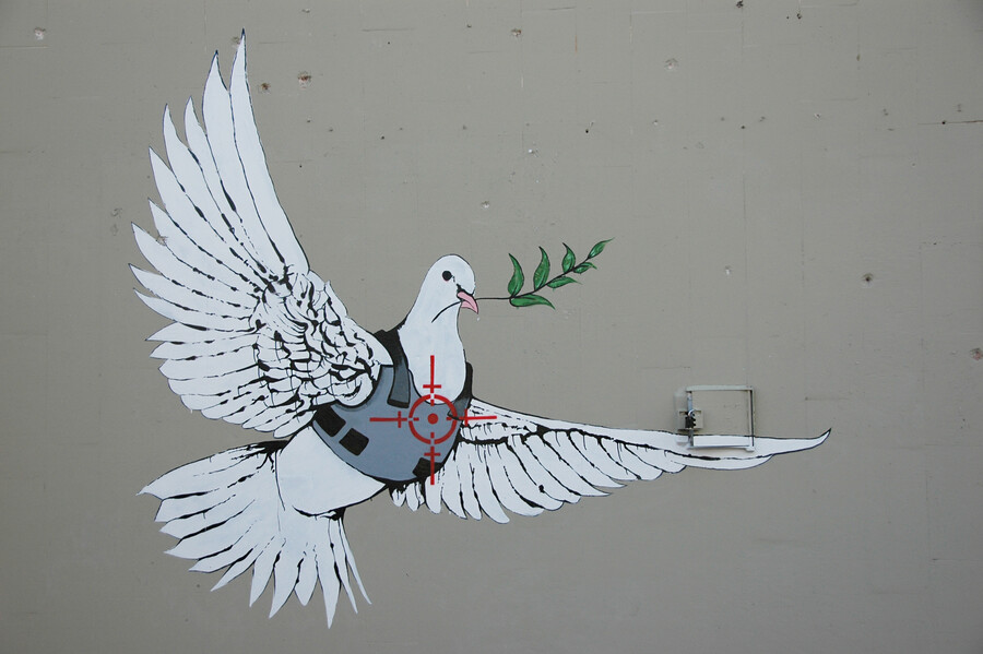 Friedenstaube auf der Mauer, die Israel von den Palästinensischen Gebieten trennt.